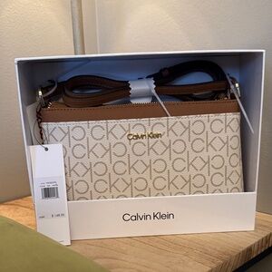 Calvin Klein Tan and Brown Logo Crossbody Bag
H5GGEJOP4 New with tags and box